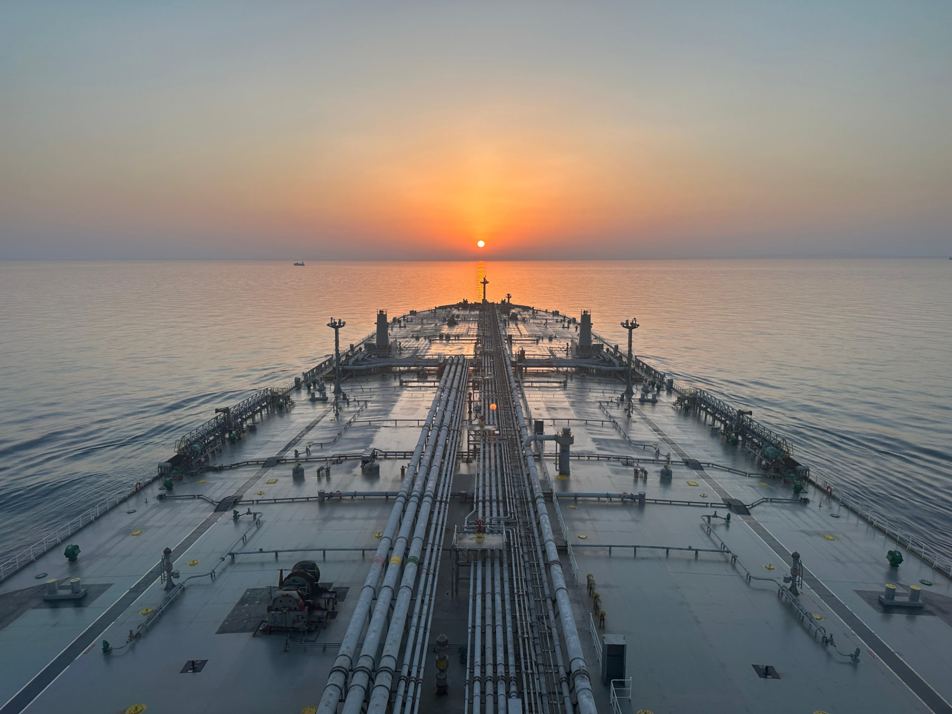 Commercial cargo ship at sea during blue hour