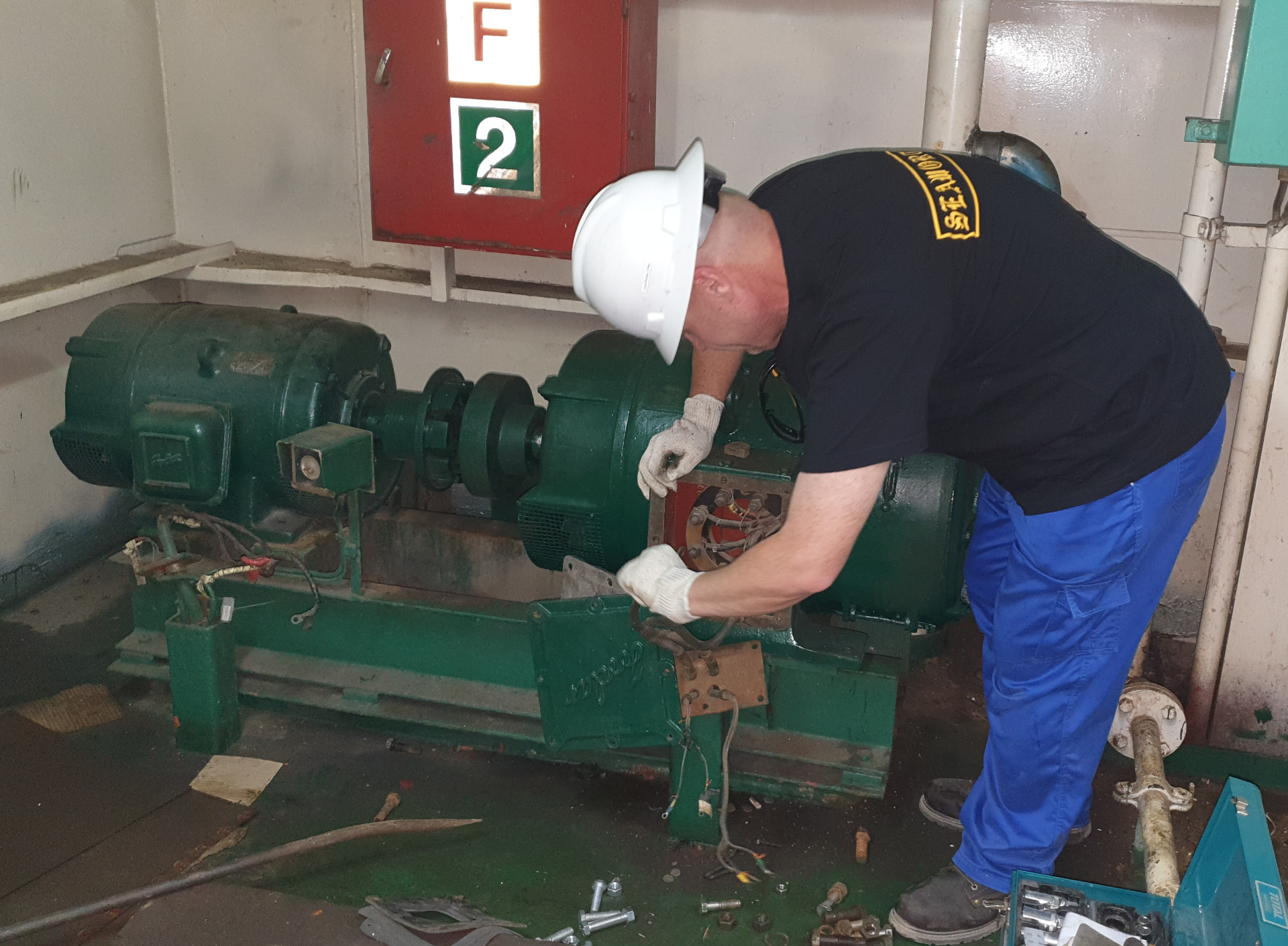 Marine engineer at engine-room automation control panel